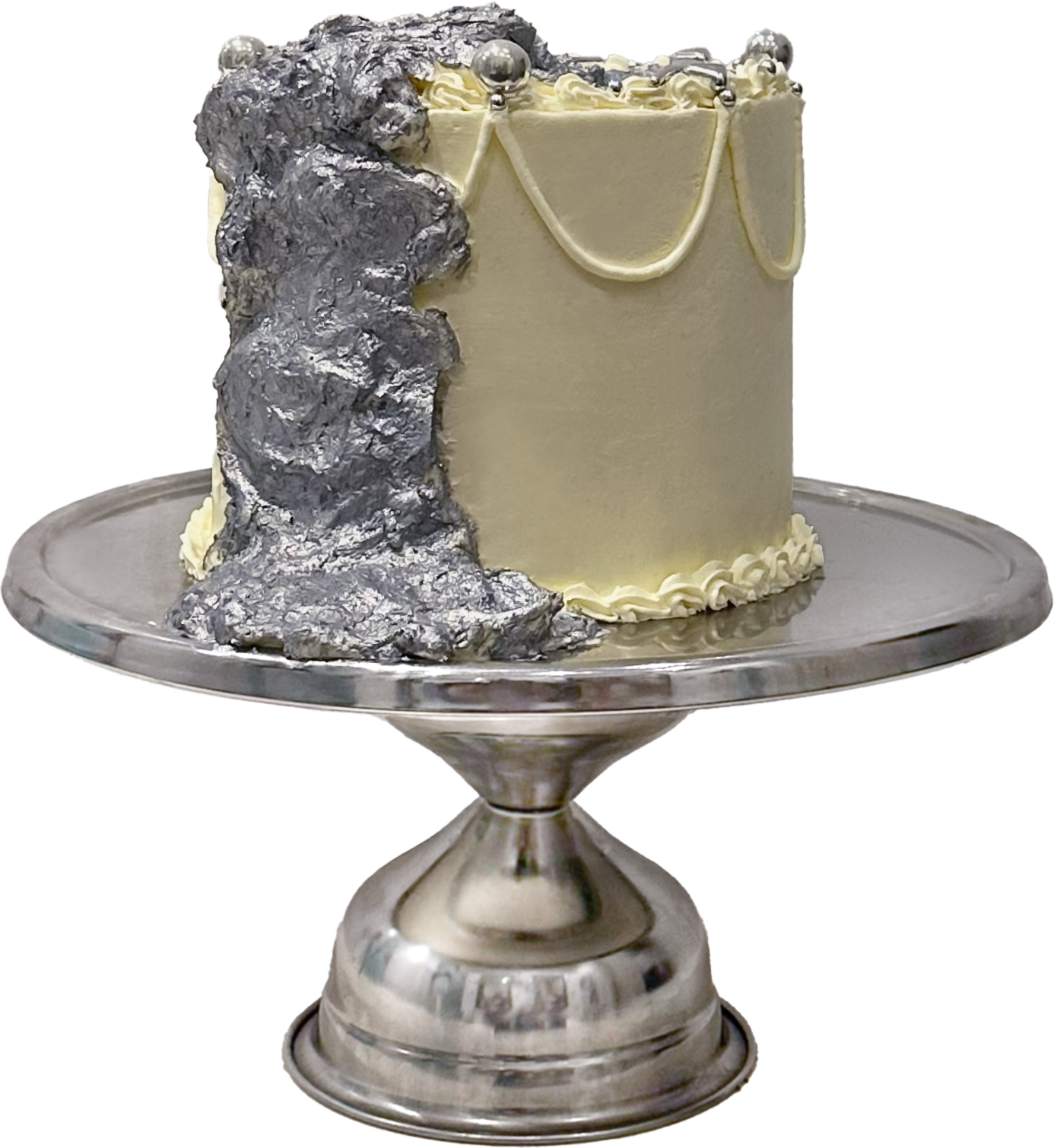 a cake half coated in silver